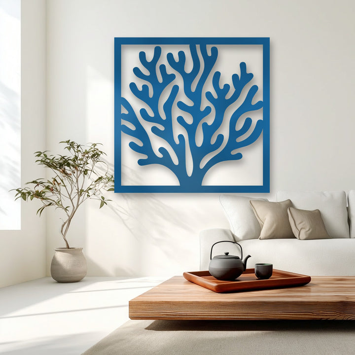 This vertically oriented, square-shaped deep blue coral-inspired metal wall decor features an intricate organic design within its frame.