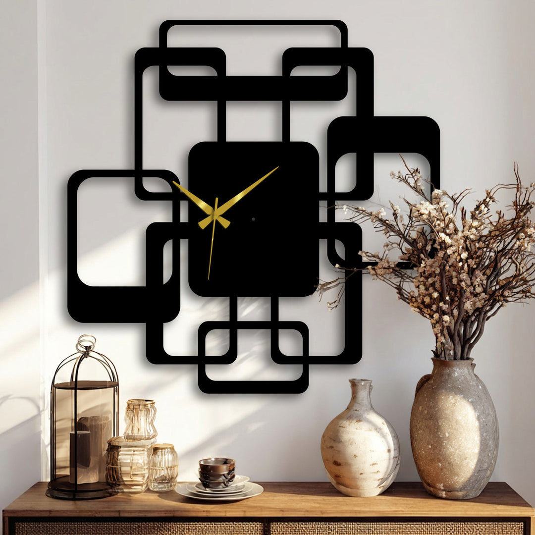 Black finish highlights the modern interlocking squares of this unique metal wall art clock, bringing a contemporary geometric touch to any room.