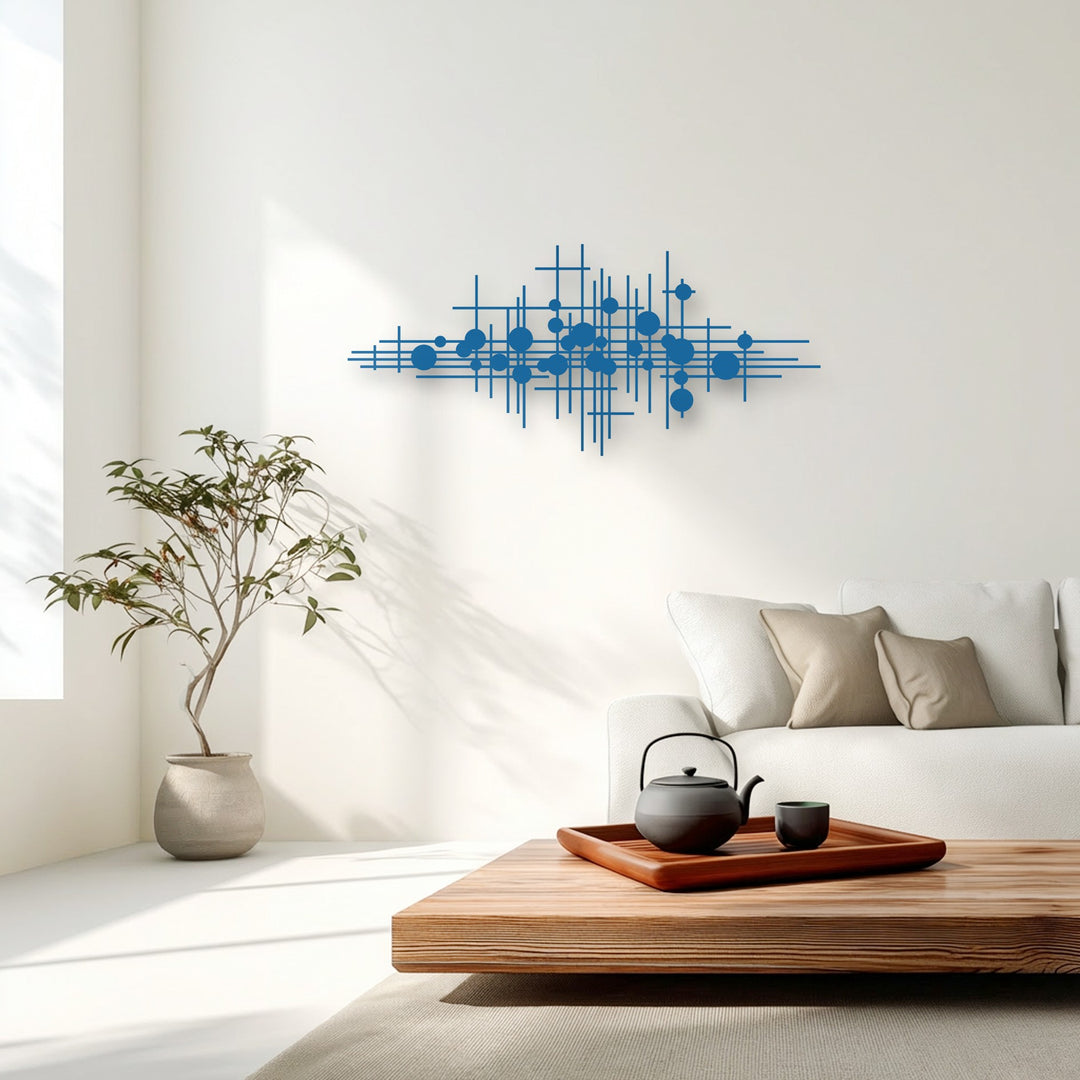 The striking transition between the bold blue unique metal wall art and the subtle shades of the sunlit white wall creates engaging visual contrast.