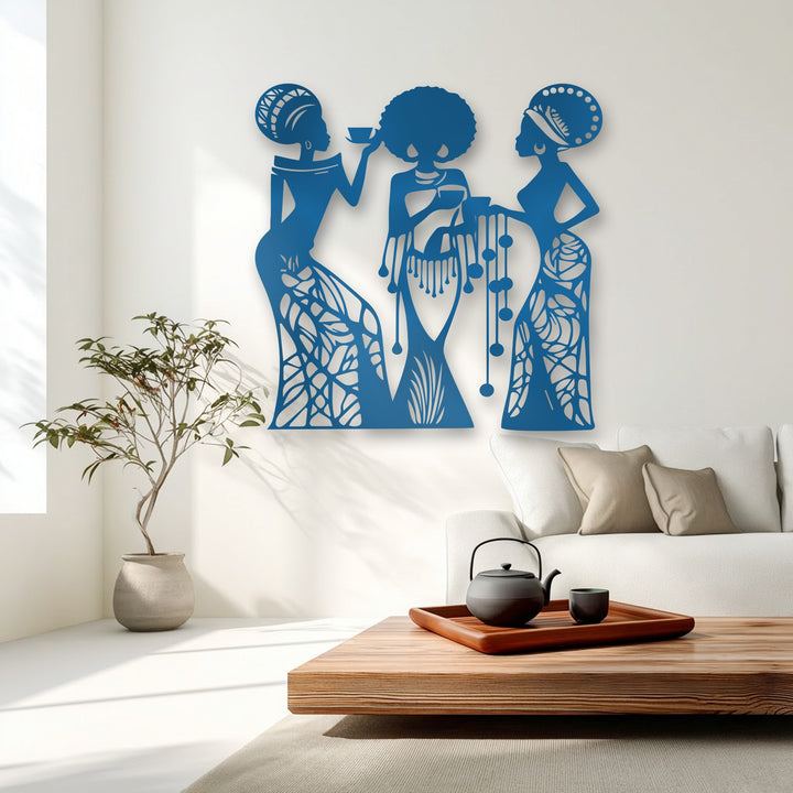 The sleek, uniform surface texture of the blue unique metal wall art depicting three women with intricate silhouette designs.