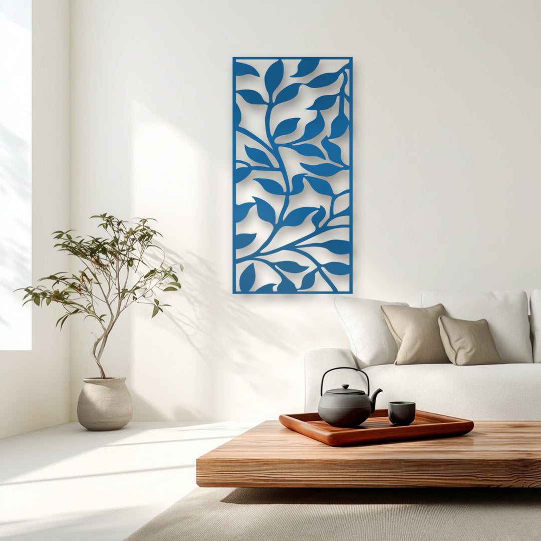 The darkest area, a sleek black teapot and cup on a wooden table, subtly complements the vibrant abstract leaf metal wall decor.