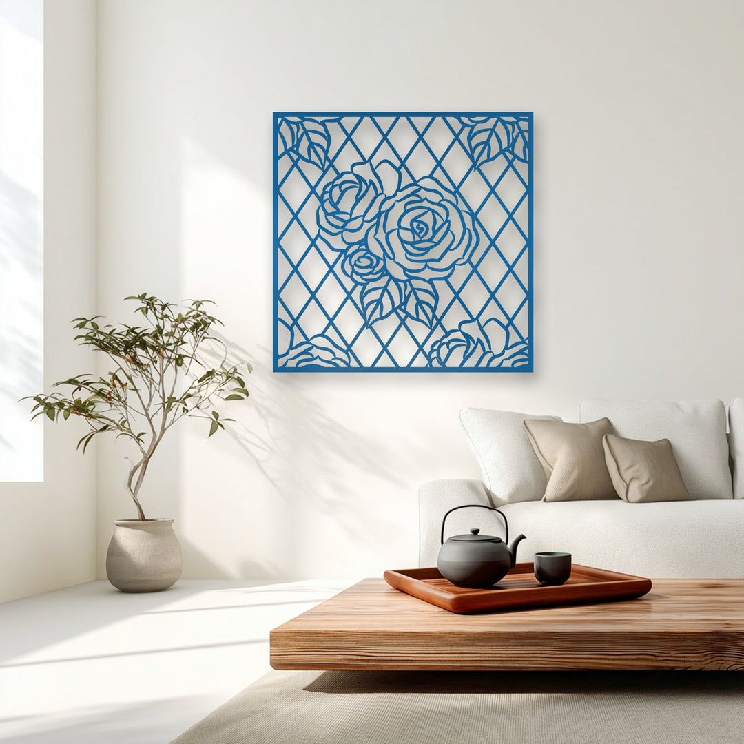 Organic forms of delicate roses and leaves are intricately cut into this striking blue metal decoration wall art, enhancing the modern living space.
