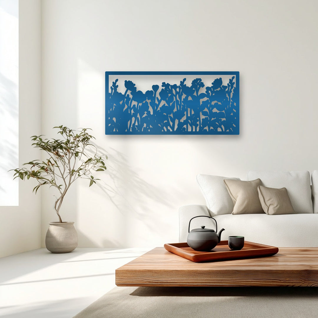 The smooth, matte texture of the blue metal wildflower silhouette decoration wall art contrasts with the soft rug.