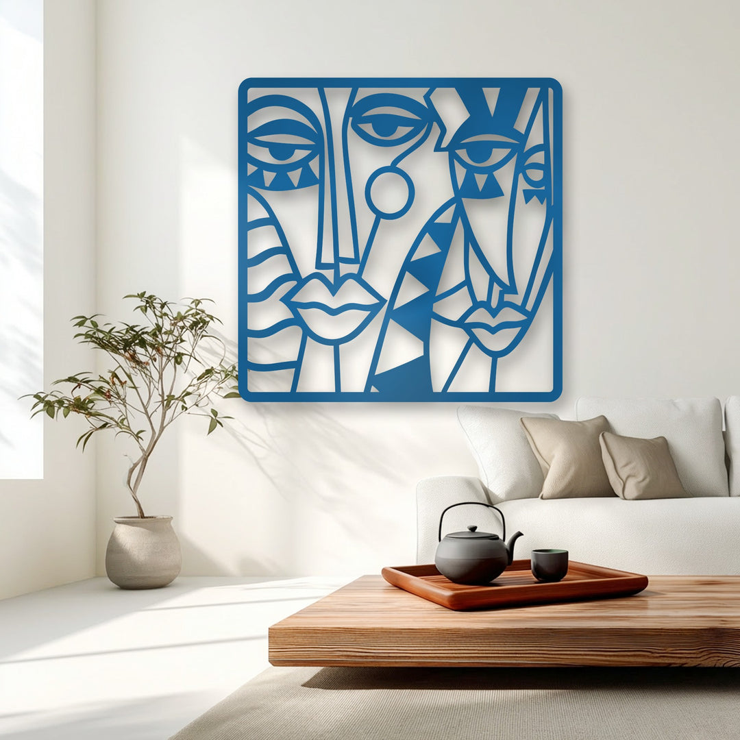 The focal point of the room is a striking piece of decorative metal art, showcasing a vibrant blue modern cubist abstract faces composition.