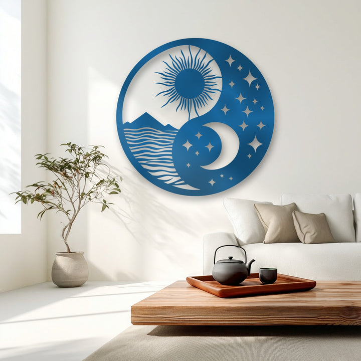 The blue metal wall decor exhibits a subtle, brushed surface texture across its celestial sun, moon, and landscape design.