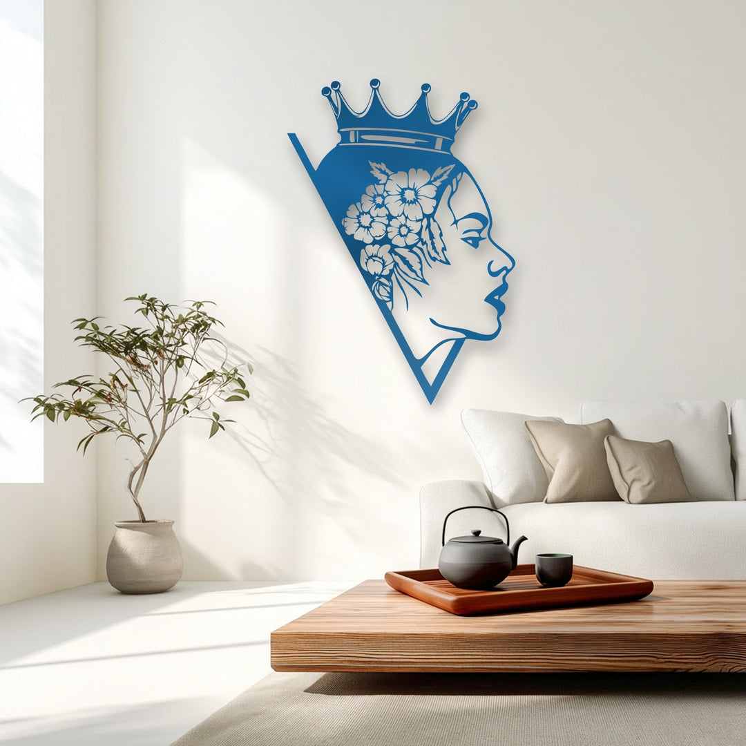An abstract blue metal wall decor depicts a stylized Floral Queen silhouette with delicate floral patterns in her hair.