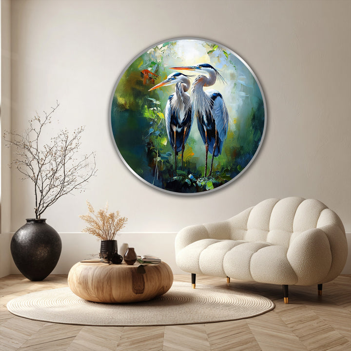 The focal point highlights this elegant oil painting artwork of a graceful heron pair in lush green tones, a round wildlife wall art exuding harmony and companionship.
