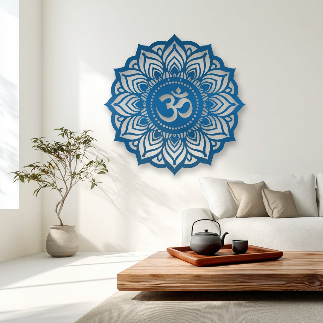 Striking color contrast highlights the vibrant blue sacred Om mandala decorative metal art against the serene white wall.