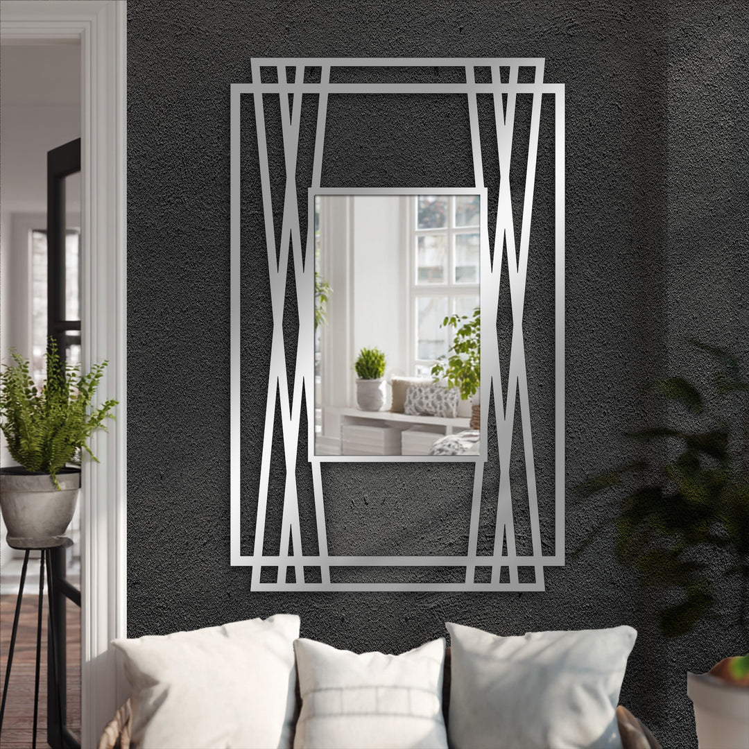 The dynamic angles of this modern black metal artwork frame suggest a sense of movement around the floor mirror, enhancing the experience of decorating with wall mirrors.