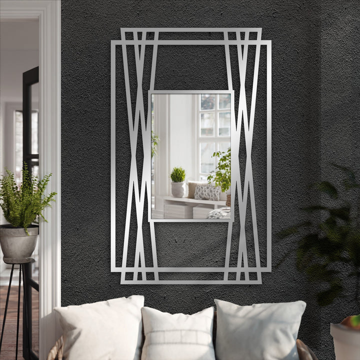 The dynamic angles of this modern black metal artwork frame suggest a sense of movement around the floor mirror, enhancing the experience of decorating with wall mirrors.