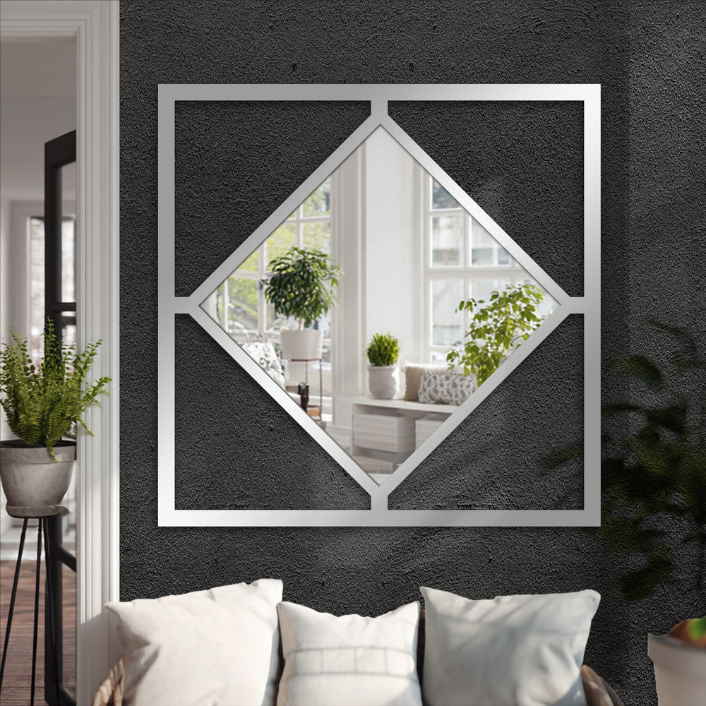 Dark textured background highlights the gleaming diamond frame square decorative mirror, a modern geometric metal artwork.