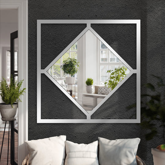 Dark textured background highlights the gleaming diamond frame square decorative mirror, a modern geometric metal artwork.