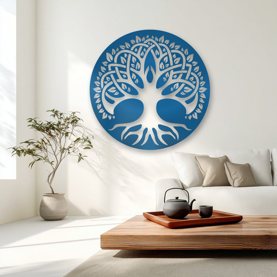 The cool color temperature of this scene highlights the azure Celtic Tree of Life decorative metal art circle against pristine white walls.