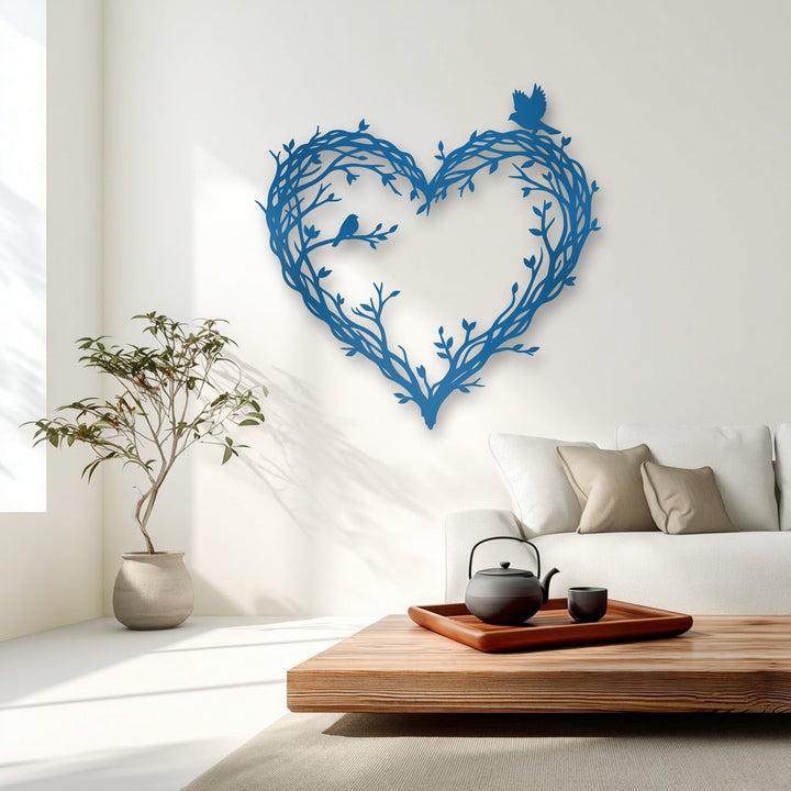 The realistic detail of the vibrant blue bird and branch heart-shaped decorative metal art against the pristine white wall is strikingly lifelike.
