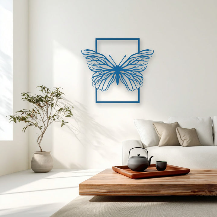 An invitingly warm color temperature permeates this serene living space, featuring vibrant blue butterfly frame metal artwork on a crisp white wall.