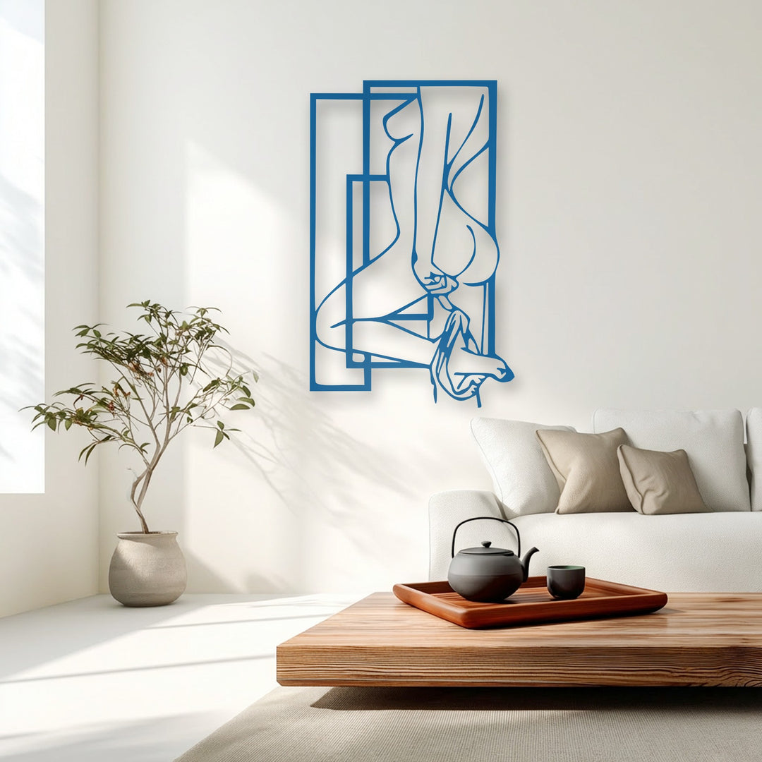 The bright, sun-drenched white background wall, adorned with subtle light and shadow patterns, offers a minimalist canvas for the blue metal artwork.