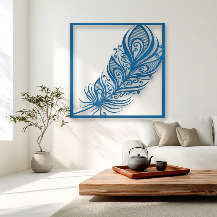 Dynamic swirls within the ornate blue feather metal art for wall gracefully sweep across the white space, implying delicate, airy motion.