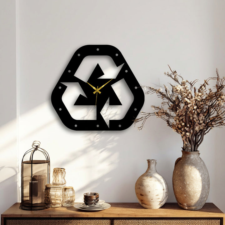 Displaying the realistic detail, a recycle symbol metal wall clock with a gold-tone, silent mechanism offers a unique metal wall art option for modern decor.