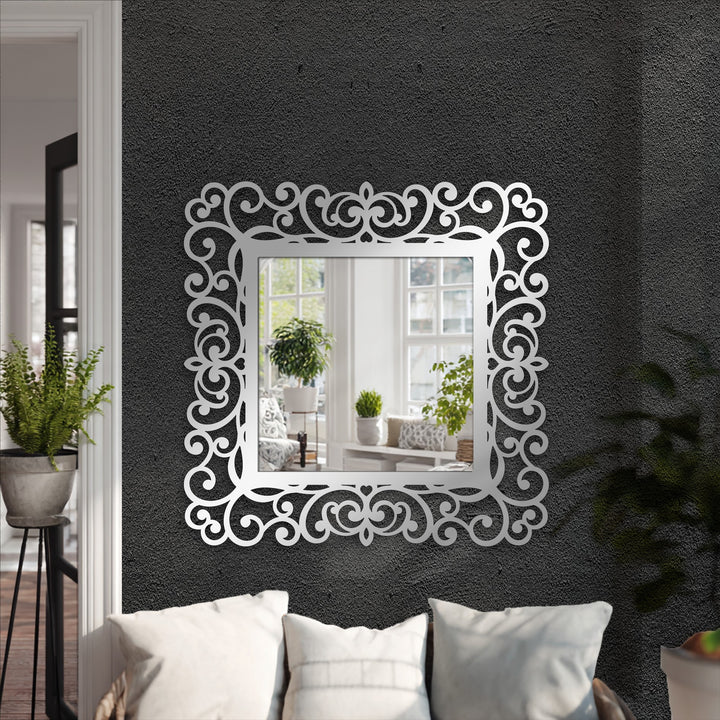 Featuring subdued color saturation, the ornate scrollwork around this decorative mirror showcases a reflective scene of a softly lit interior.