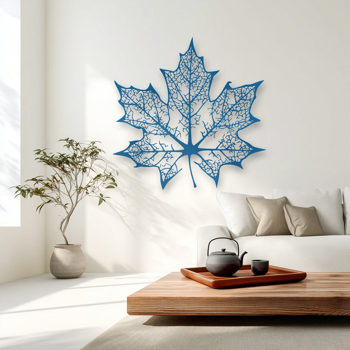 Organic forms of an azure maple leaf metal wall decor showcase intricate, nature-inspired vein detailing in a stunning silhouette.