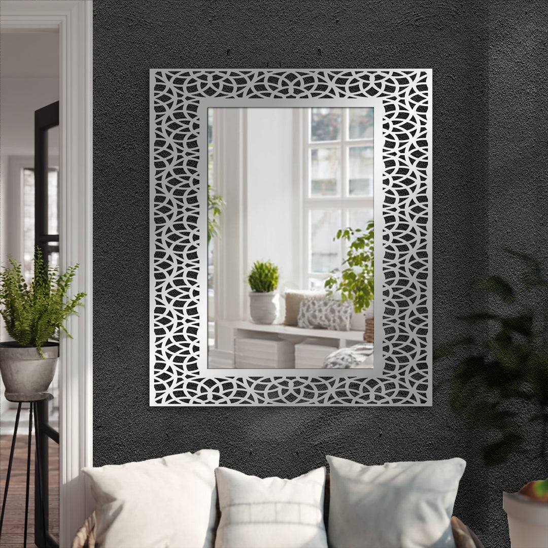 Geometric interlocking arc pattern accents the frame of this modern wall mirrors, adding a unique style to the rectangular-shaped mirror.