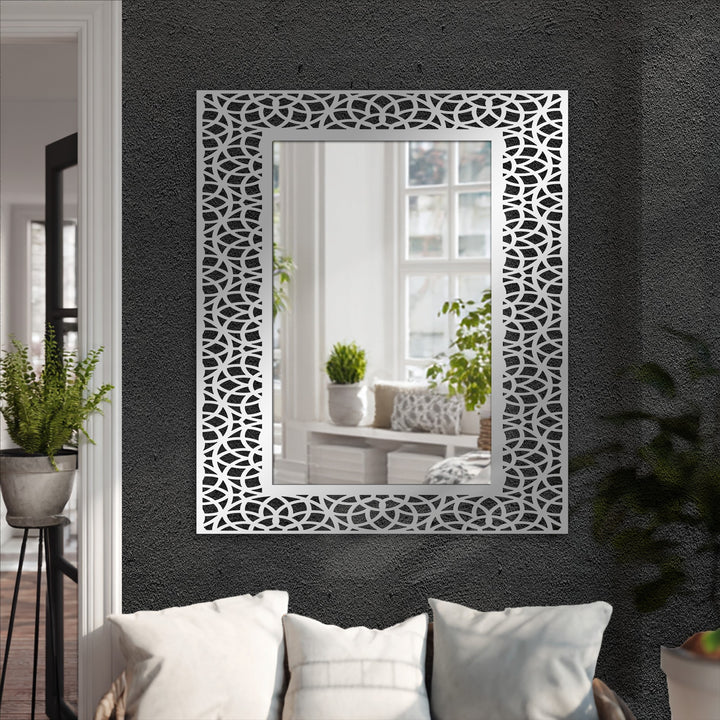 Geometric interlocking arc pattern accents the frame of this modern wall mirrors, adding a unique style to the rectangular-shaped mirror.