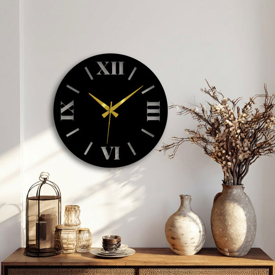 Warm color temperature highlights the gold hands and silver numerals on this stylish modern metal artwork wall clock, creating a striking contrast against the black face.