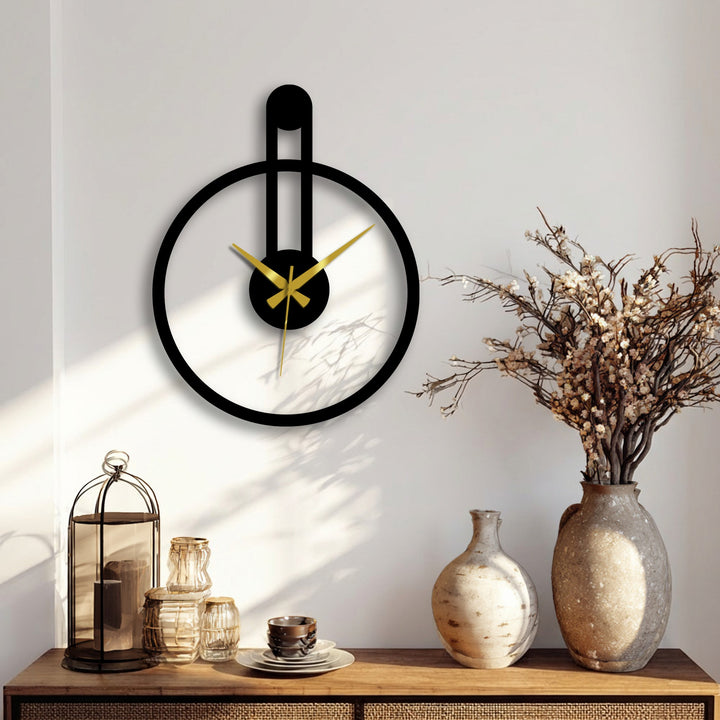 Featuring geometric interplay, a round decoration wall art clock with an elongated vertical accent creates a striking minimalist focal point.