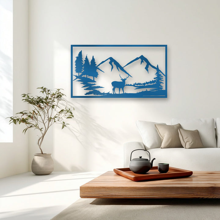 A precise, angular cutout of a deer silhouette amidst sharp mountains and pointed pine trees forms a captivating blue metal art for wall.