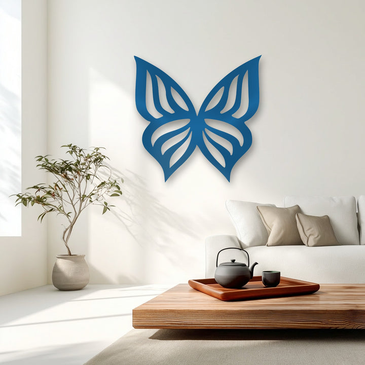 The elegant butterfly silhouette, a piece of decorative metal art, creates striking depth and layers with its subtle shadow against the bright wall.
