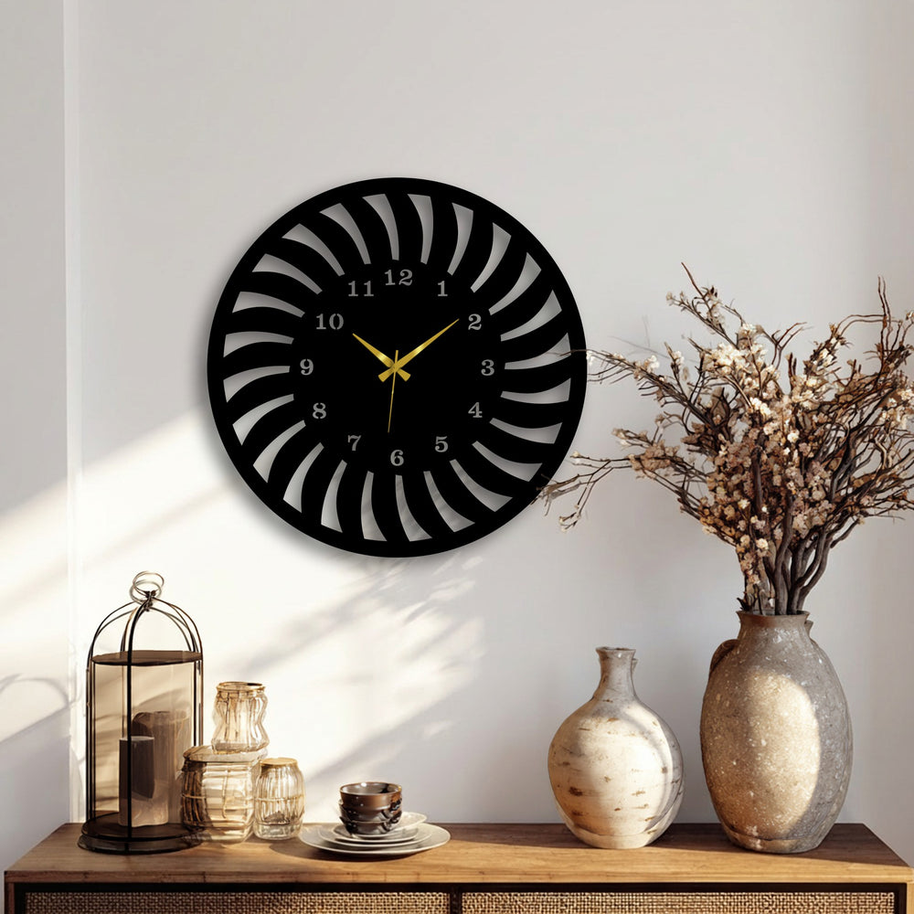 The sleek matte black finish of this radial pattern metal wall clock offers contemporary decoration wall art.