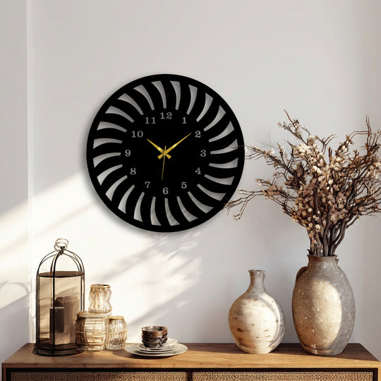 The sleek matte black finish of this radial pattern metal wall clock offers contemporary decoration wall art.