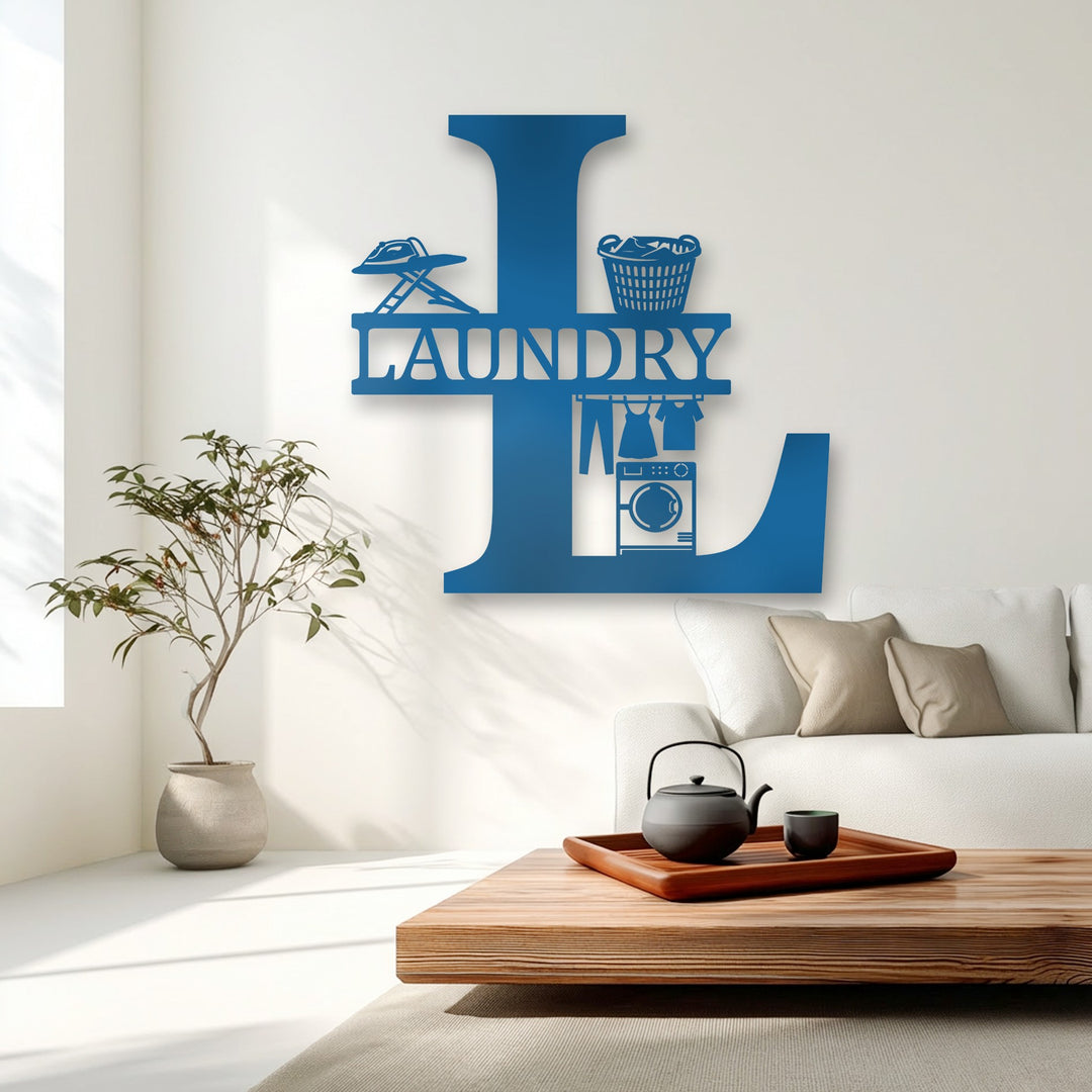 A vibrant azure 'L' initial laundry monogram, unique metal wall art, with an iron, basket, hanging clothes, and a washer.
