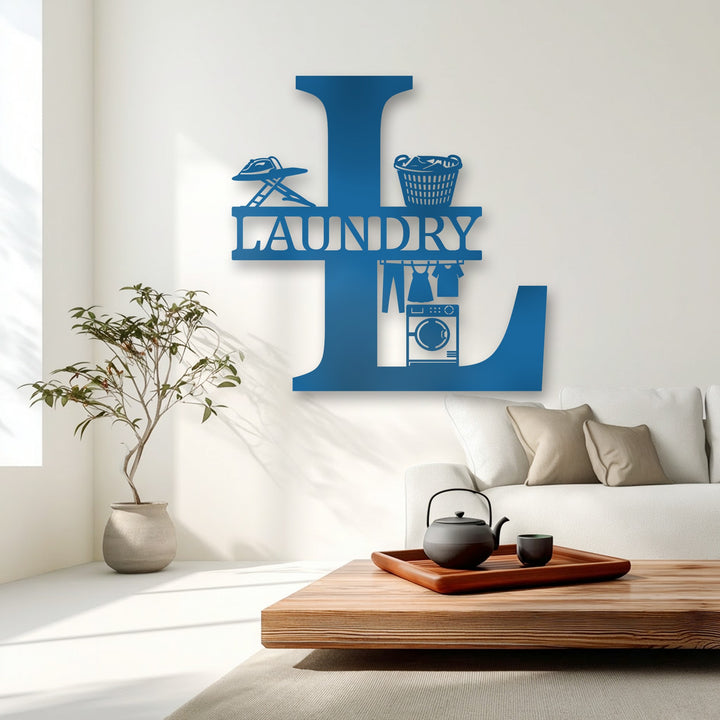 A vibrant azure 'L' initial laundry monogram, unique metal wall art, with an iron, basket, hanging clothes, and a washer.