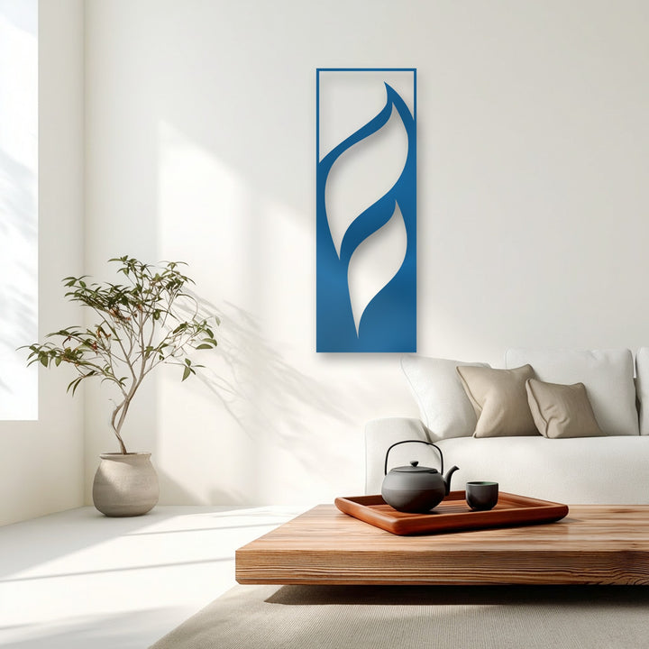 The darkest area highlights a black teapot and cup on a wooden tray, complementing the unique metal wall art with flowing leaves design.