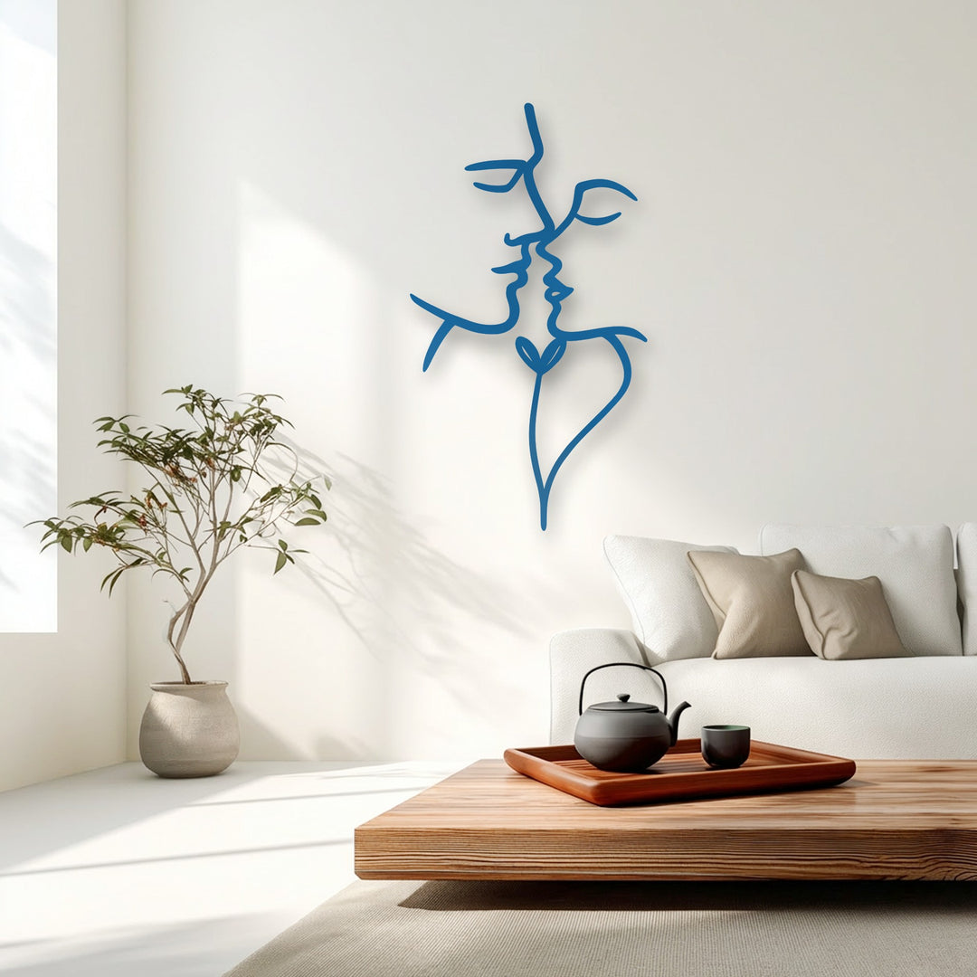 A vibrant blue abstract face decorative metal art piece exhibits high color saturation, contrasting with the muted, softly lit modern living room.