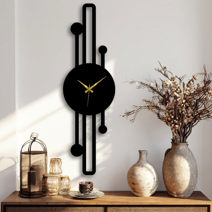 Featuring a sleek black finish, this vertical minimalist metal artwork wall clock showcases geometric lines and gold hands for a modern touch.
