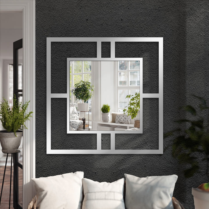 Gray hues dominate this modern mirror, featuring a square geometric metal frame that serves as striking decorative metal art for any space.