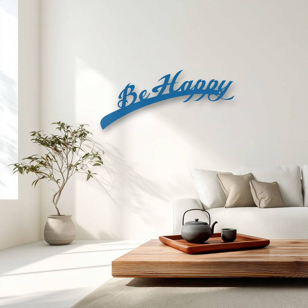 The image showcases vibrant color saturation, highlighting the bright blue 'Be Happy' script metal wall decor against a muted, serene living room backdrop.