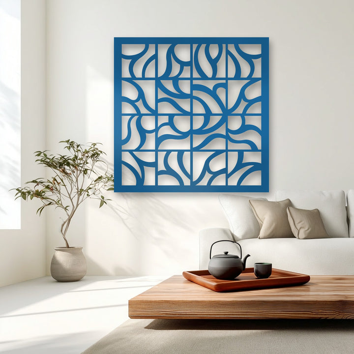 Deep blue decorative metal art showcases a striking geometric flow grid design on a brightly lit wall.