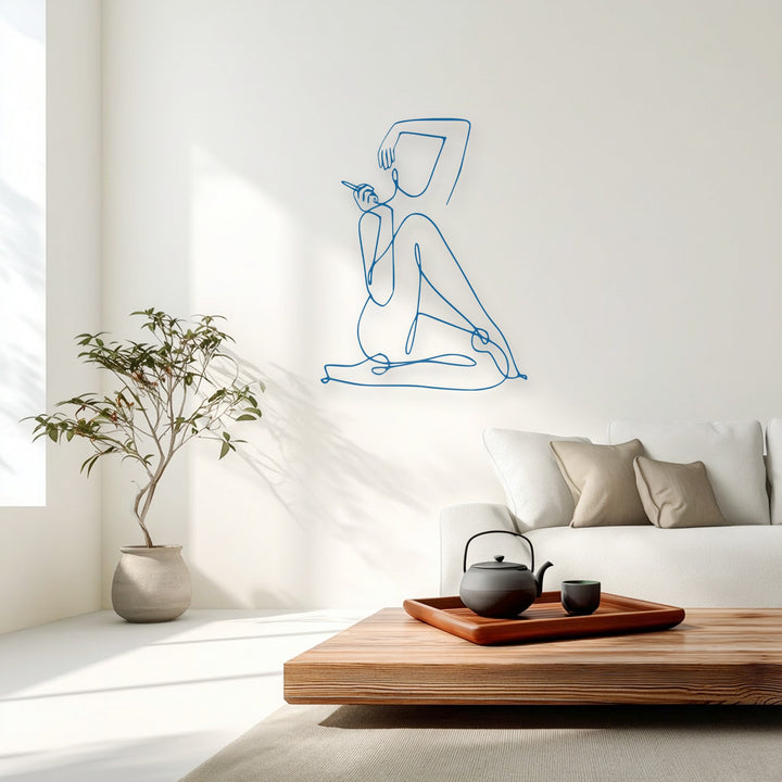 The abstract quality of this minimalist azure female line art metal decoration wall art beautifully stands out on a bright wall.