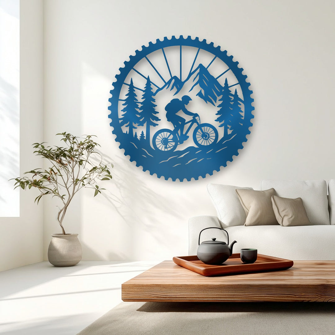 The abstract design of this azure metal art for wall depicts a stylized mountain bike adventure within a cog-like silhouette, capturing the spirit of movement.