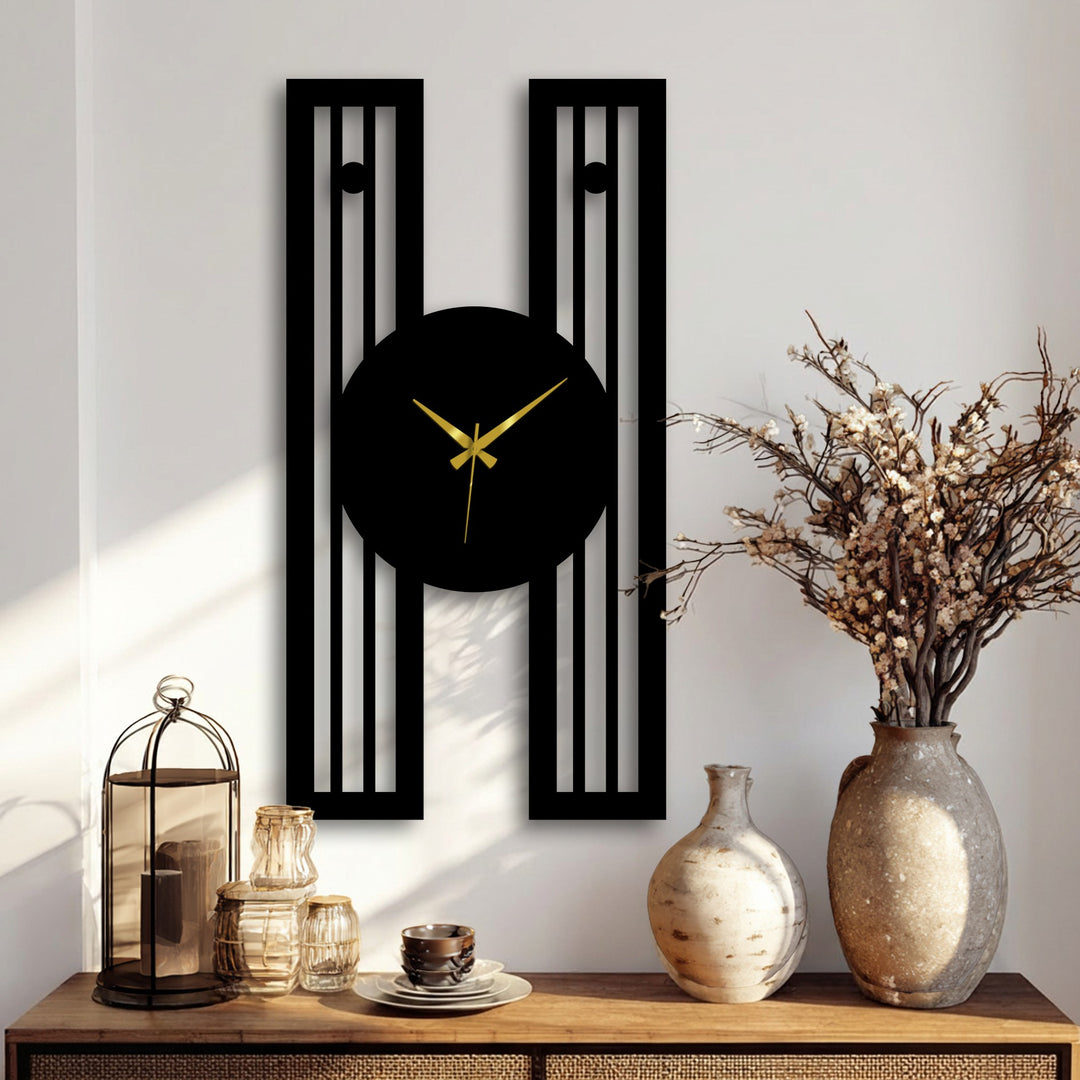 Modern black geometric wall clock, the loudest element, showcases a unique metal wall art design with gold hands, making it an elegant focal point.