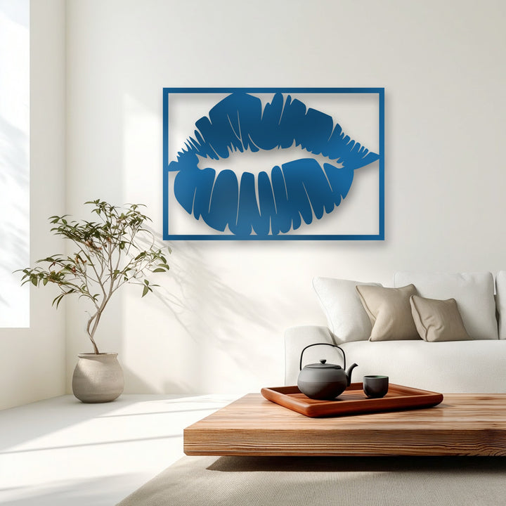 A calm, sophisticated mood fills the minimalist room, highlighted by the striking blue Bold Kiss Silhouette metal artwork.