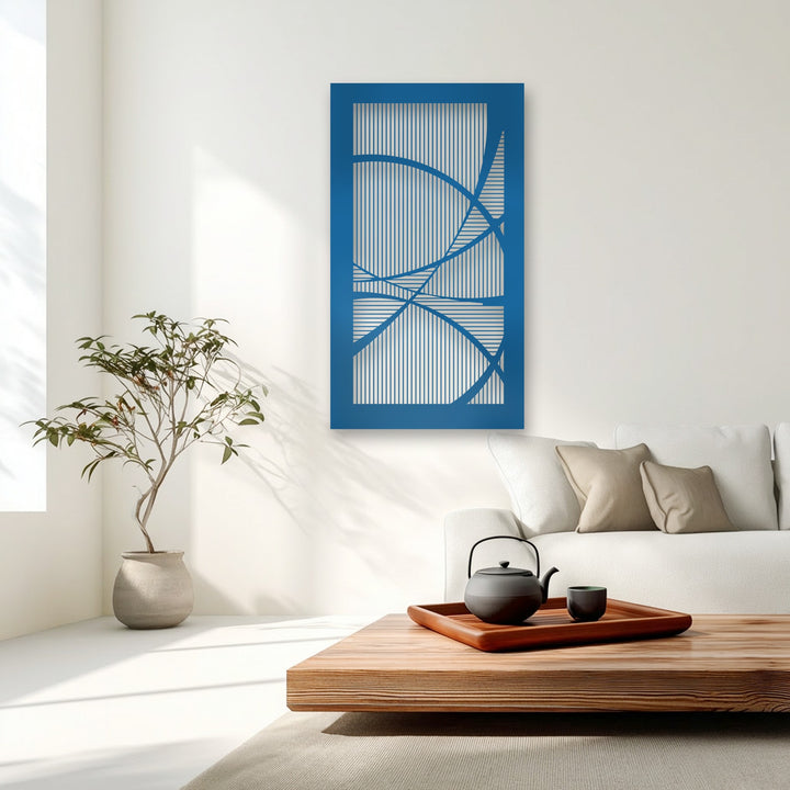 Vibrant blue geometric abstract metal wall decor, showcasing intricate lines and curves, acts as the focal point in this modern room.