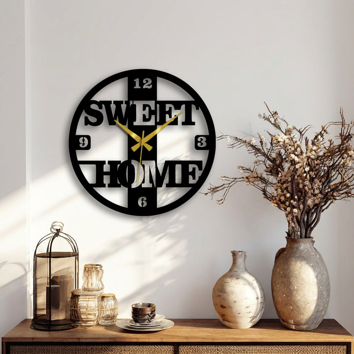 Plain white background highlights the sweet home decorative metal art wall clock, creating a simple and modern contrast.