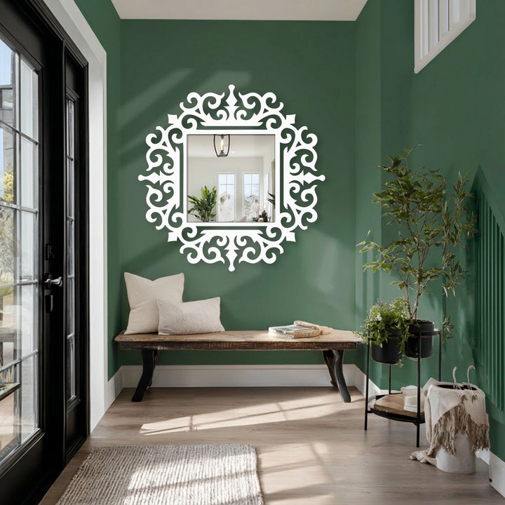 High color contrast highlights the ornate baroque frame of this royal scroll square floor mirror as a piece of unique metal wall art.