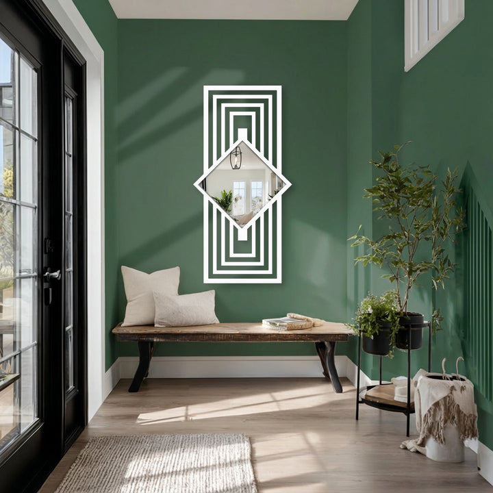 Vibrant color contrast highlights the white framed stained glass wall mirror against a deep green wall, reflecting light and enhancing the geometric decoration wall art.