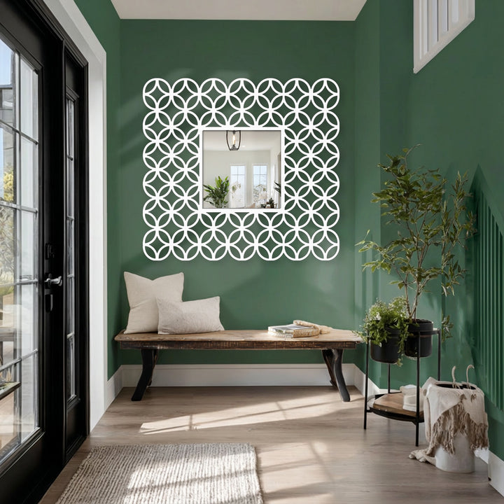 The organic forms of the interlocking ring pattern add visual interest to this decoration wall art mirror with its square frame and modern design.