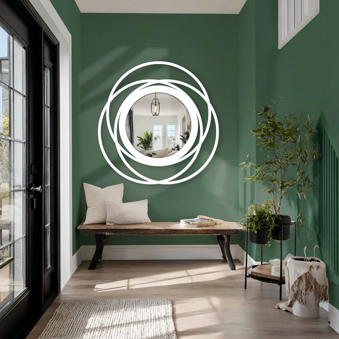 Negative space highlights the intertwined circles of this modern floor mirror, a bold design that elevates decorating with wall mirrors through a striking silhouette.